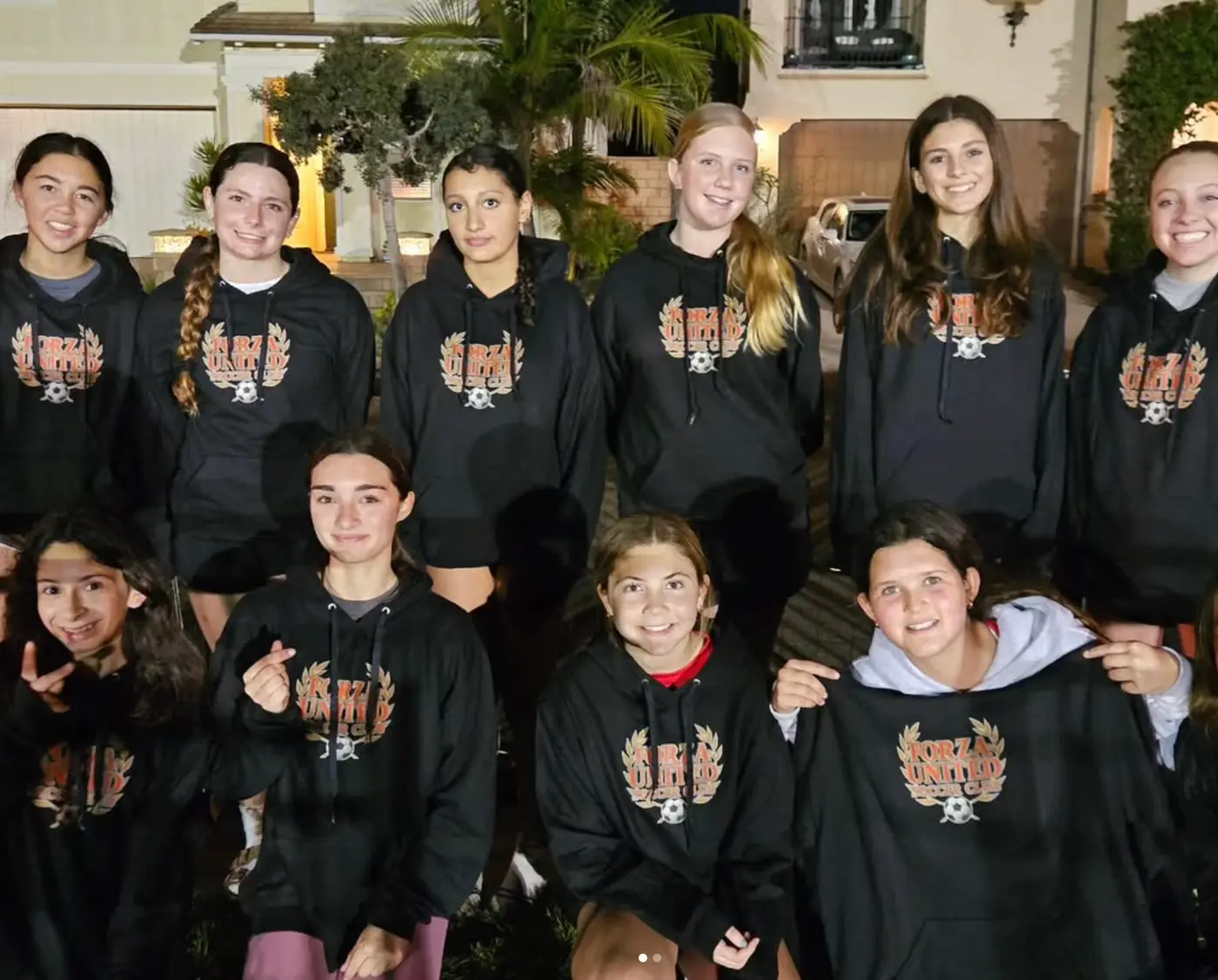 Players together in Forza United crest hoodies on a team night